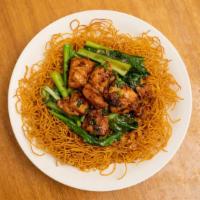 Minute Chicken Fried Noodle · Sautéed boneless chicken with red bean curd placed on choy sum gravy. Served over crispy Hon...