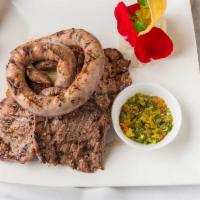 Argentinean Parrillada · Skirt steak, Hanguer, flat iron, shell steak, sausage, yucca, potatoes, chimichurri sauce