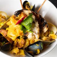 Magno'S Paella · Lobster, shrimp, mussles, clams, chorizo, chicken scallops, saffron rice.