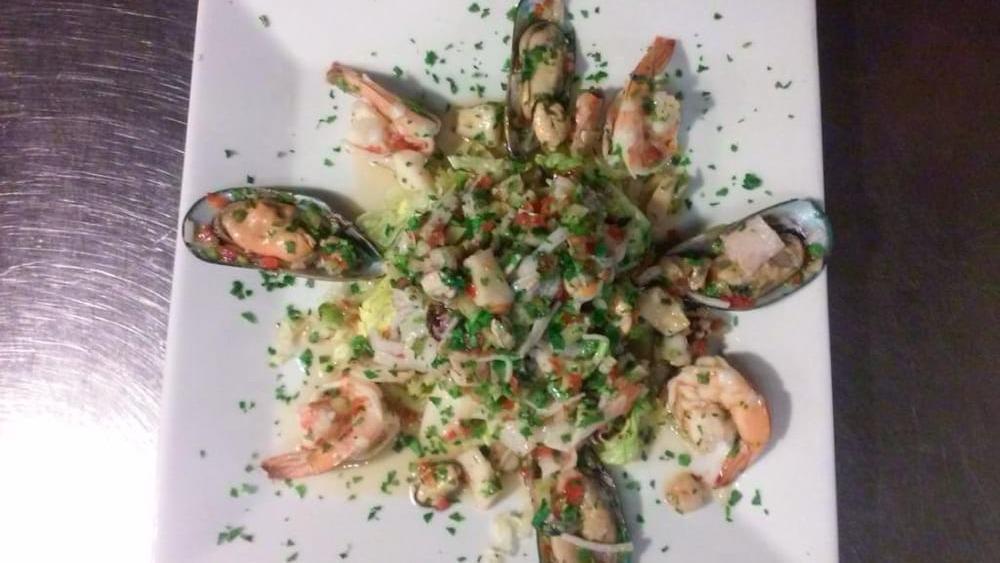 Ensalada De Mariscos · Seafood salad.