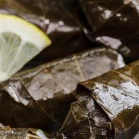Stuffed Grape Leaves · Delicately rolled grape leaves stuffed with rice and spices.