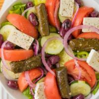 Classic Greek · Traditional Greek salad with mixed greens, cucumbers, tomatoes, Feta, green peppers, Kalamat...