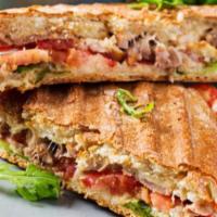 Grilled Chicken & Red Pepper Panini · Freshly grilled chicken, fire roasted red pepper, housemade pesto and melted mozzarella.