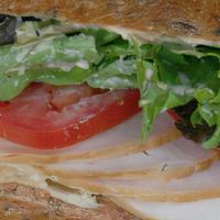 Smoked Turkey Sandwich
 · Served with field greens and plum tomatoes and your choice of bread and dressing.
