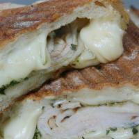 Smoked Turkey And Pesto Panini
 · Served with smoked turkey, Swiss, fresh pesto and a touch of olive oil, and your choice of b...