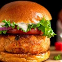 Salmon Burger · with pepperoncini tartare sauce, baby arugula, pickled bermuda onions & french fries