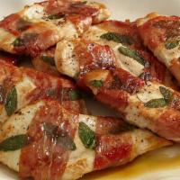 Chicken Saltimbocca · Chicken scallopini topped with prosciutto and mozzarella in a white wine sauce over sautéed ...