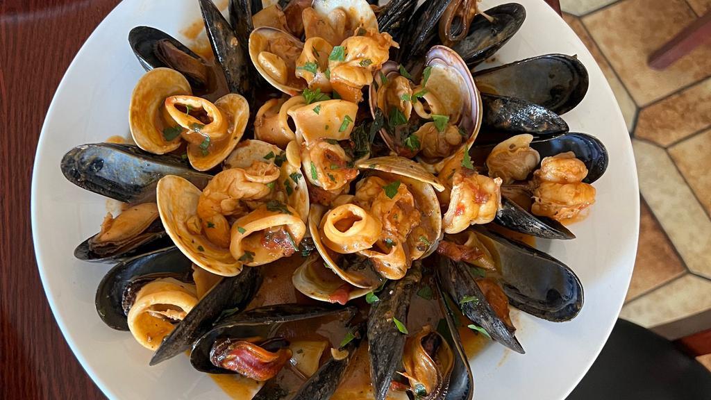 Seafood Combination · Clams,shrimp,mussels, calamari in garlic white wine sauce or marinara sauce.