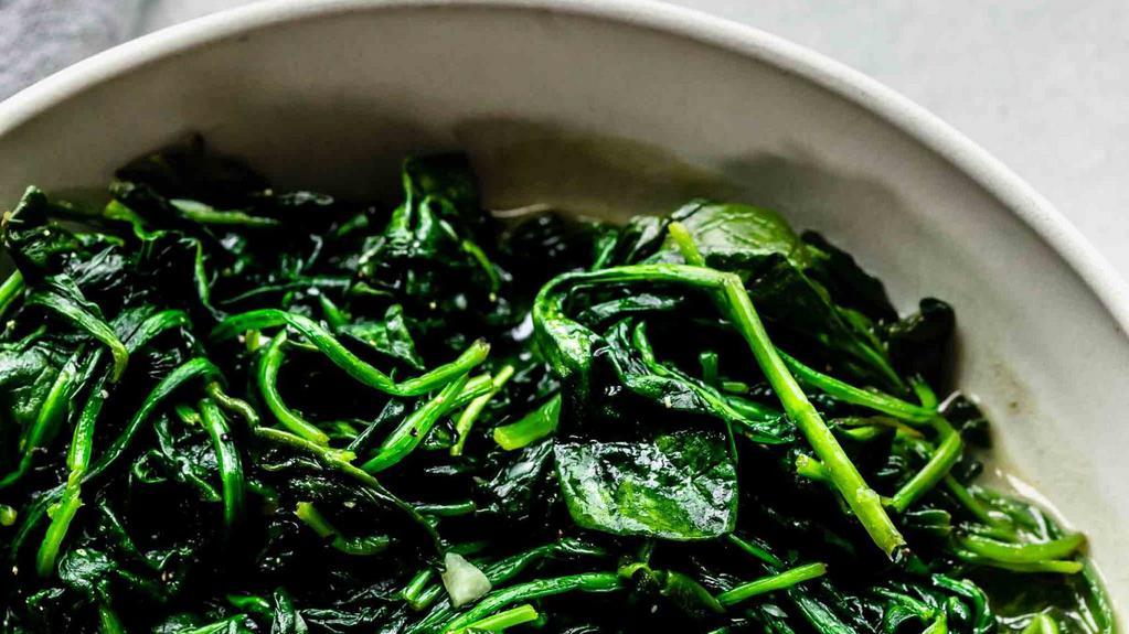 Spinach · Fresh spinach sautéed with fresh garlic and extra virgin olive oil.