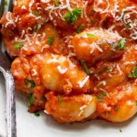 Gnocchi Tomato Sauce · Soft Italian dumpling, spinach, sun-dried tomatoes, hot and sweet sausage, in a white wine c...