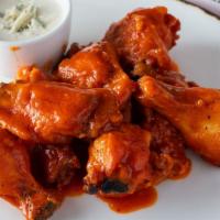 Buffalo Chicken Wings · Served with blue cheese and celery