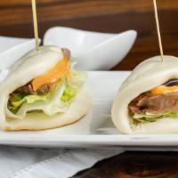 Buns (2 Pcs) · Steamed bun, lettuce, spicy mayo, and eel sauce.