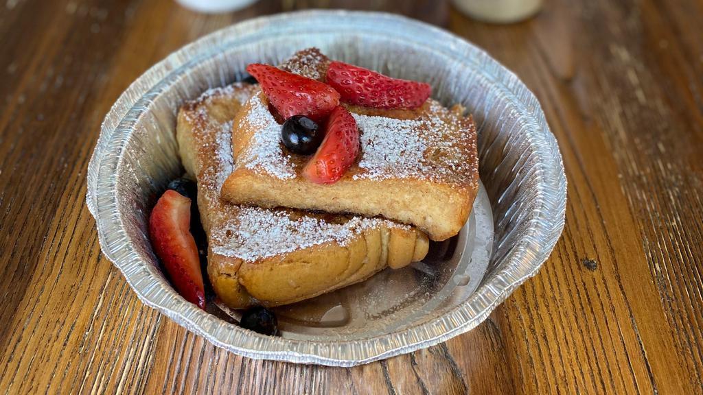 Vegan French Toast · Golden vegan french toast served with fruits.