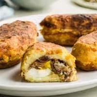 Papa Rellena · Peruvian style  Mashed potato stuffed with minced beef, olives and hard boiled eggs
Addition...