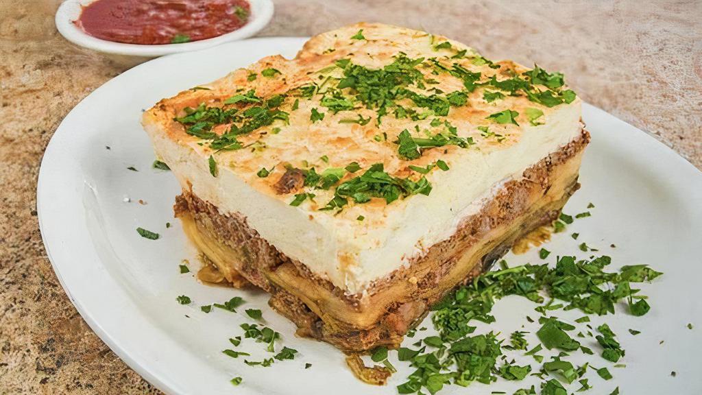 Moussaka · Layers of eggplant, seasoned ground beef, and potatoes topped with bechamel sauce. Served with choice of side salad, potato, rice, vegetable medley, or soup.