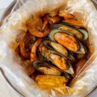 The Cajun Boil · Served with 1/2 lb of Crawfish, 1/2 lb of Black Mussels, and 1/2 lb of Head-off Shrimp Inclu...