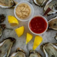 Steamed Oysters · Original Cajun, garlic butter, lemon pepper or the hook reel special blend.
