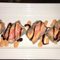 Magic Roll · Rock shrimp tempura inside, top with spicy lobster and kani with spicy Cajun sauce and eel s...