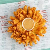 Blooming Onion · Served with a honey mustard sauce.