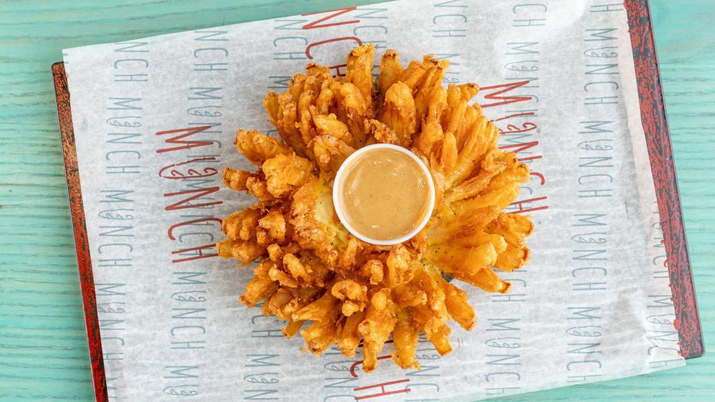 Blooming Onion · Served with a honey mustard sauce.