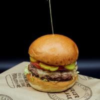 Village Bison Burger · Grass-fed, antibiotic and hormone free, hand formed patty.