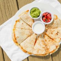 Quesadillas De: · Flour tortillas stuffed with, three-cheese blend and chicken or beef meat Served with authen...