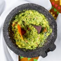 Guacamole Fresco · Freshly made table side in a molcajete.