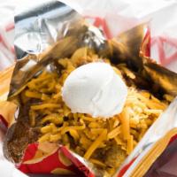 Frito Pie · Frito chips topped with brisket chili, cheddar cheese and sour cream.