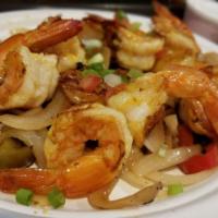 Grilled Jumbo Shrimp Fajitas · Grilled marinated jumbo shrimp fajitas, with onions and roasted bell peppers, black beans an...