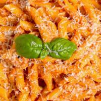 Penne Ala Vodka  · penne style pasta beaded with famous vodka sauce