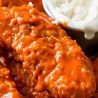 Buffalo Chicken Tender · Traditional bone-less chicken,Breaded or battered crispy chicken.  brined & hand-tossed in y...