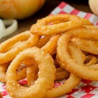 Onion Rings · Battered onion rings deep fried and seasoned to perfection .