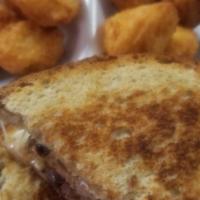 Patty Melt And Onion Rings · Hamburger, grilled onions, roasted pepper mayo and swiss cheese on rye bread. With Onion Rings