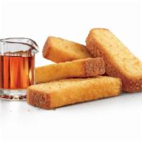 French Toast Sticks · Four French Toast Sticks with Syrup