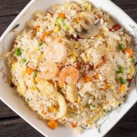 Young Chow Fried Rice / 揚州炒飯 · Egg, snow peas, mushroom, celery, beef, chicken, pork, shrimp use white rice.