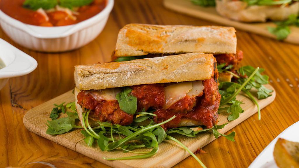 Meatballs Sandwich · Homemade 100% angus beef meatballs with tomato sauce served on our fresh Ciabatta Bread with Parmigiano Cheese and Fresh Arugula