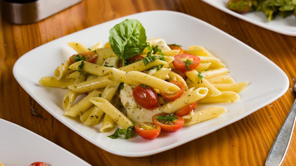 Pasta Caprese Salad · Organic Italian pasta, organic cherry tomato, fresh basil, organic fresh mozzarella PDO, and extra virgin olive oil.