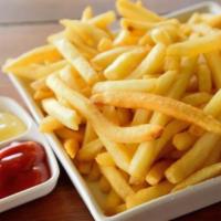 Papas Fritas · French fries cooked with the Dominican Style.