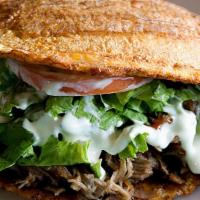 Patacon De Pernil · These patacones use fried plantains as sandwich carriers Shredded roasted Pork, mozzarella c...