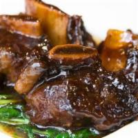 Red Cooked Short Ribs In Hang Chow Style · 4 large short ribs braised with soy and rock candy, then stewed in red wine sauce, and serve...