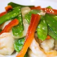 Beijing Prawns · Prawns marinated in egg white and sautéed in rice wine sauce with snow peas and water chestn...