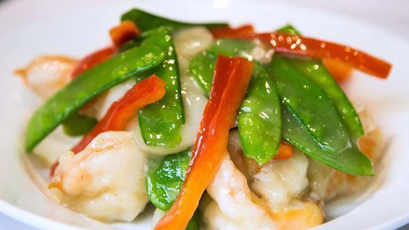 Beijing Prawns · Prawns marinated in egg white and sautéed in rice wine sauce with snow peas and water chestnuts.