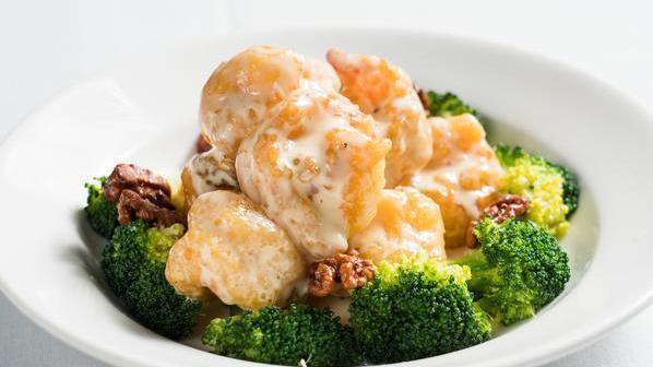 Grand Marnier Prawns · Prawns coated with water chestnuts flour, cooked till crispy, then sautéed in a grand marnier sauce, topping with honey walnuts.