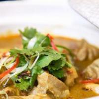 Tingling Curry Chicken Hot Casserole · Chucks of tender chicken cooked with curry, chili pepper, and lemongrass in clay pot with ti...