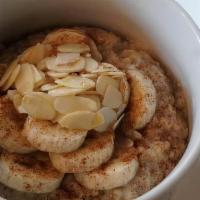 The Lower East · Steel cut oatmeal (gluten free) with choice of milk. Topped with bananas, cinnamon, brown su...