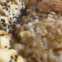 Creamylicious Oatmeal Bowl · Steel Cut Oatmeal (gluten free) with almond milk. Topped with banana, peanut butter, chia se...