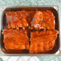 Baby Back Ribs · Smokey, meaty and fallin' off the bone tender, our ribs are slow cooked in a tangy homemade ...