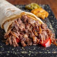 The Lamb Gyro · Sizzling thinly-sliced lamb gyro meat wrapped in with pita bread, lettuce, diced tomatoes, o...
