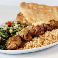 Chicken Kofta Over Rice · Kofta kabob made by head chef. Served on bed of mediterranean flavored rice, lettuce, tomato...