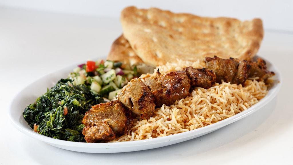 Lamb Kabob & Chicken Kofta Over Rice · Fresh sizzling hand-made lamb kabob strip with a strip of chicken kofta kabob over rice. Served with lettuce, tomatoes, onions and peppers.